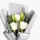 White roses with green calla lilies and eucalyptus in gray wrapping paper