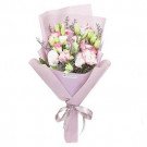 Elegant bouquet of pink and white carnations with purple wrapping and ribbon