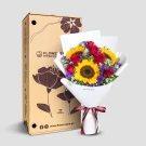 Vibrant bouquet with red roses, yellow sunflowers, and purple flowers in white wrap