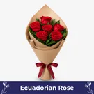 Bouquet of six red giant Ecuadorian roses wrapped in kraft paper with burgundy ribbon