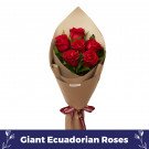 Bouquet of six red giant Ecuadorian roses wrapped in kraft paper with burgundy ribbon