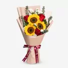 Sunflowers with red roses, white flowers, and eucalyptus in beige wrapping with burgundy ribbon