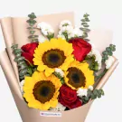 Sunflowers, red roses, white flowers, and eucalyptus in beige wrapper arrangement