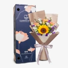 Vibrant bouquet with yellow sunflower, orange roses, purple flowers, and white baby's breath in kraft wrap