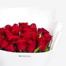 24 vibrant red roses arranged in elegant white wrapping, luxurious floral bouquet