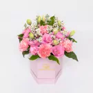 Pink carnations and white daisies in a luxe hexagonal pink gift box