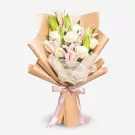 Elegant bouquet with white roses, pink lilies, and green buds in kraft paper wrapping