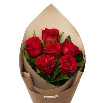 Bouquet of seven red roses with green leaves wrapped in tan kraft paper