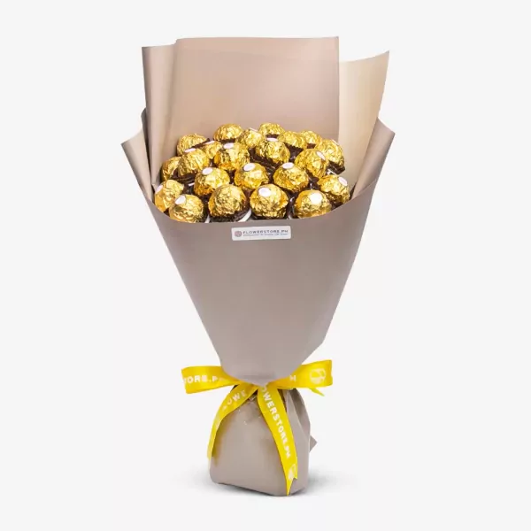 Bouquet of golden wrapped chocolates in beige paper with yellow ribbon bow