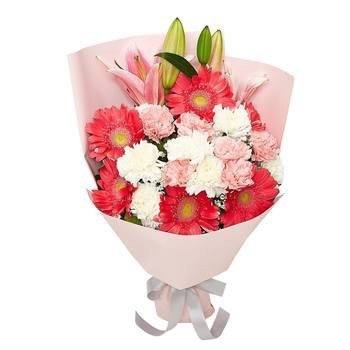 Princess bouquet with pink gerberas, white carnations, and green lily buds in soft wrapping