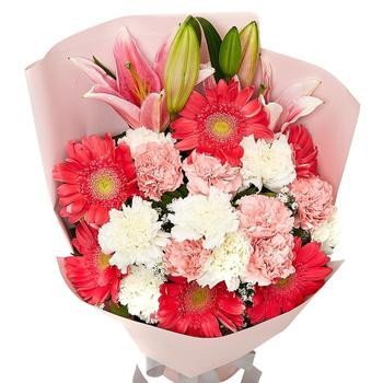 Pink wrapped bouquet with red gerberas, pink and white carnations, and lily buds