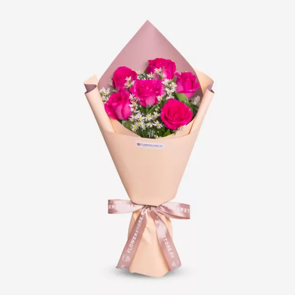 Pink wrapped bouquet with vibrant magenta roses and white filler flowers
