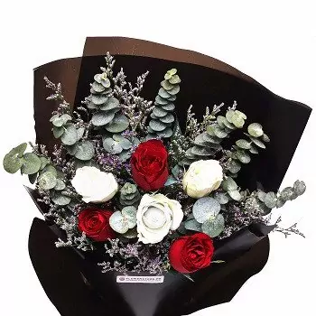 Luxury bouquet with red and white roses, eucalyptus, wrapped in black paper