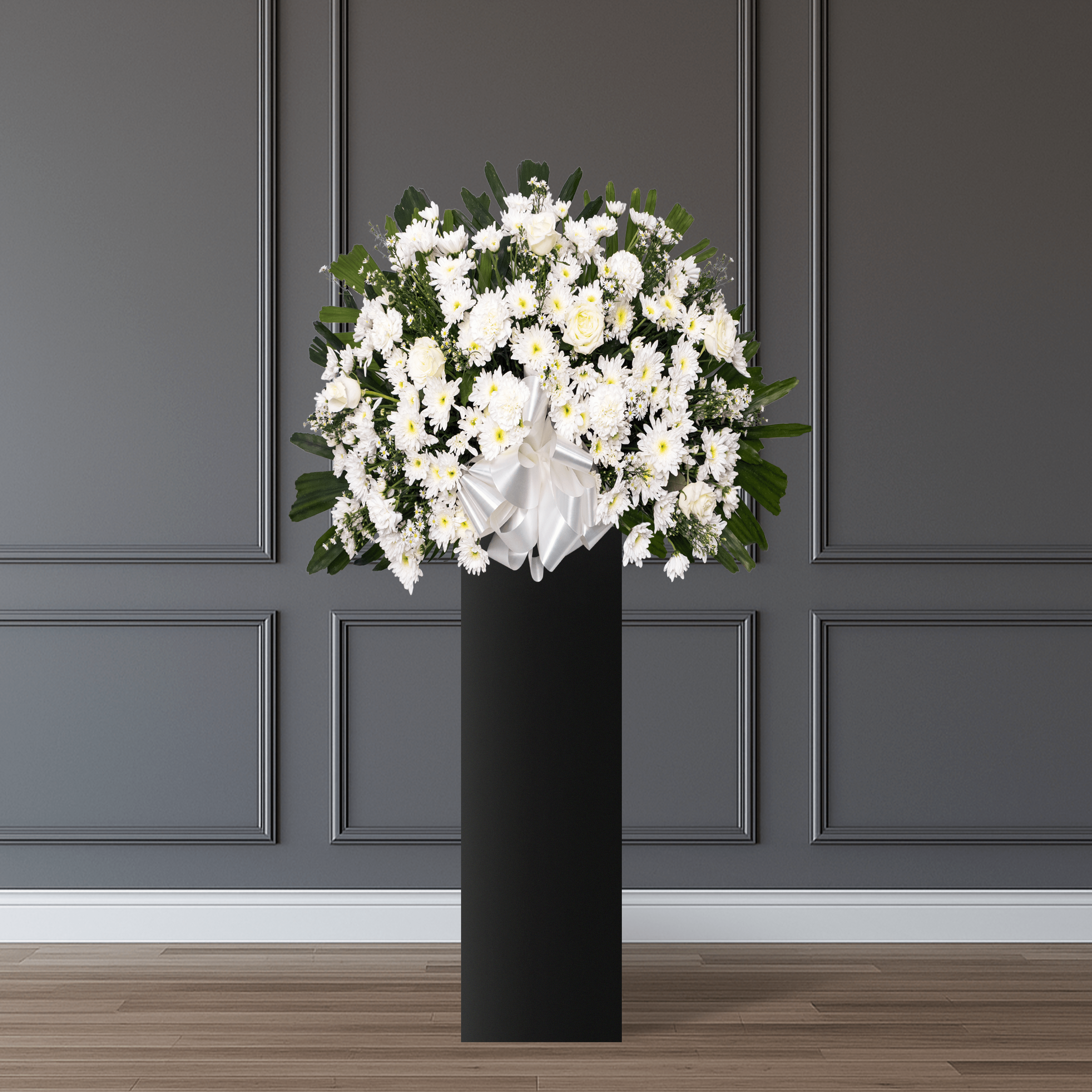 Deepest Sympathy consists of 8 white roses, 8 spray white mums, 8 white carnations, white phoenix, and finger palm leaves.