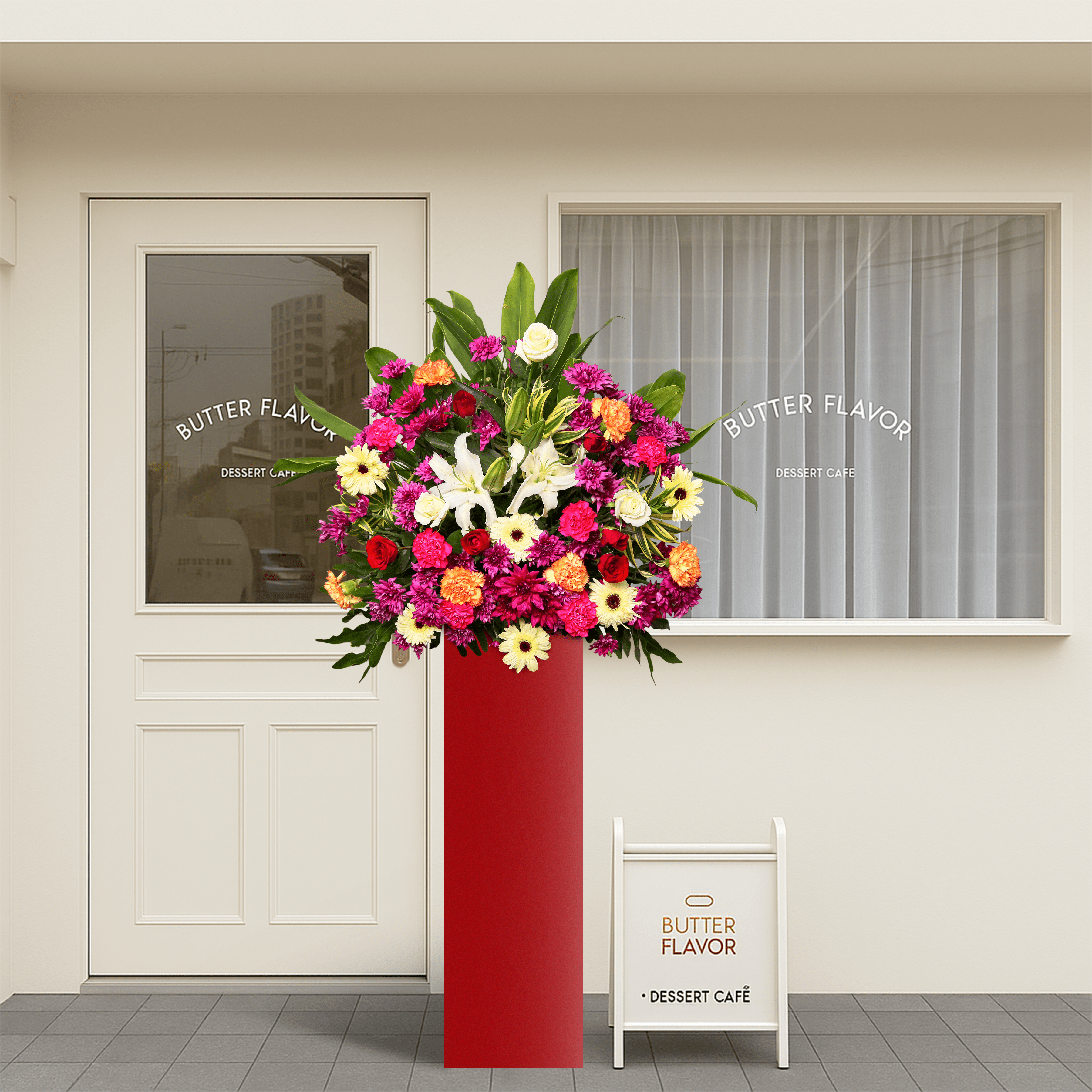Prestige Petals consists of 2 casablanca lilies, 3 white roses, 6 white gerberas, 6 fuchsia carnations, 2 orange carnations, 6 violet mums, cordyline leaves and song of India leaves.