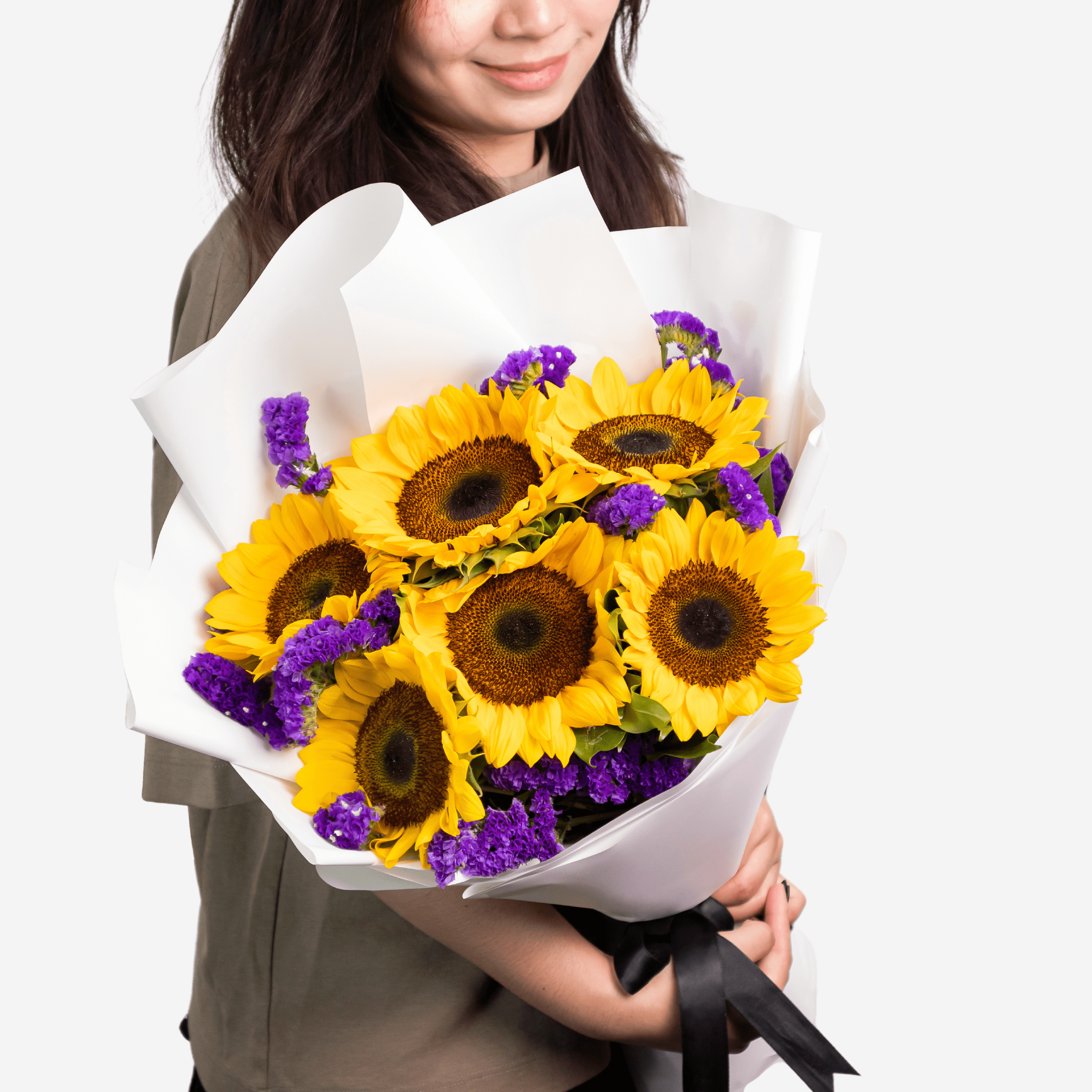 Sunny Days consists of 6 sunflowers with a touch of violet statices and rosal leaves.