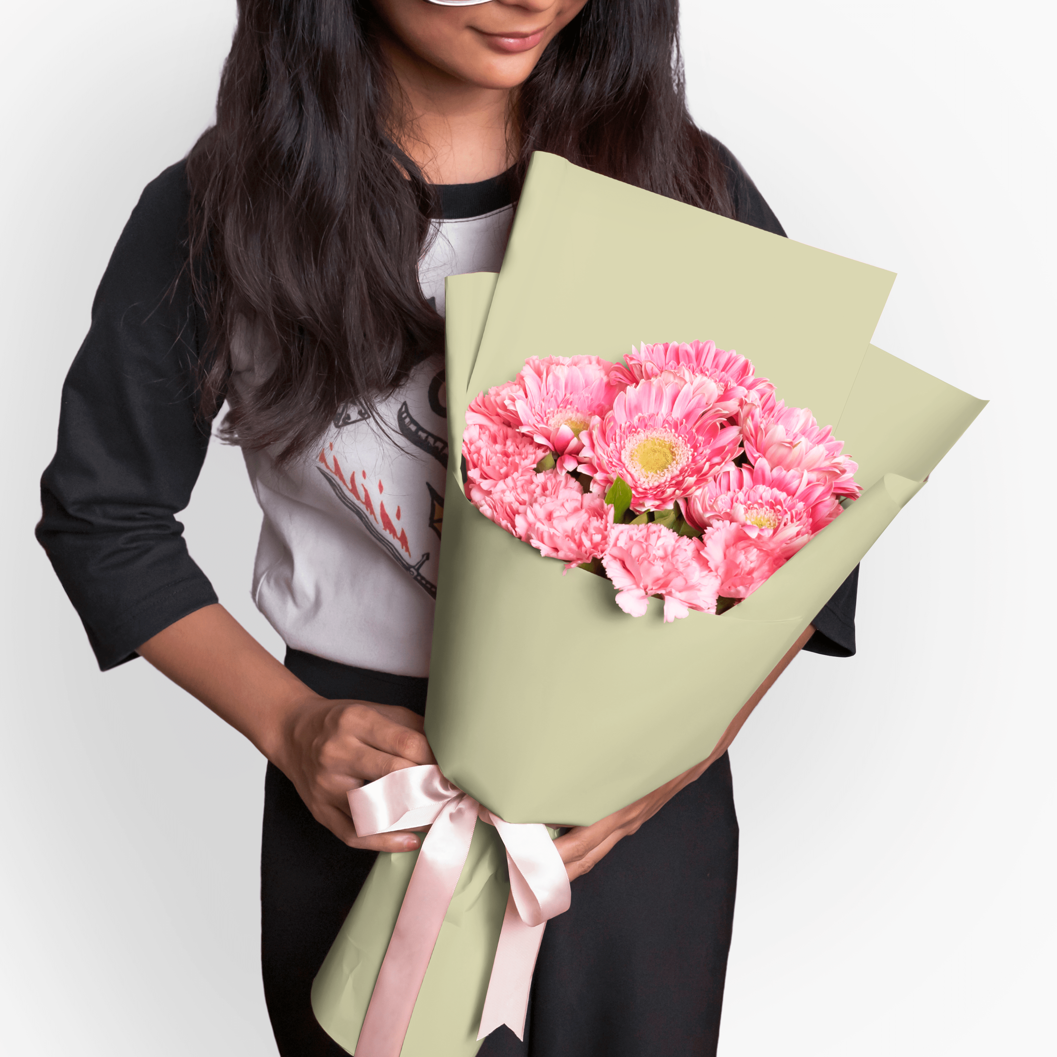 Heather consists of 5 pink gerberas, 10 pink carnations, and rosal leaves. 