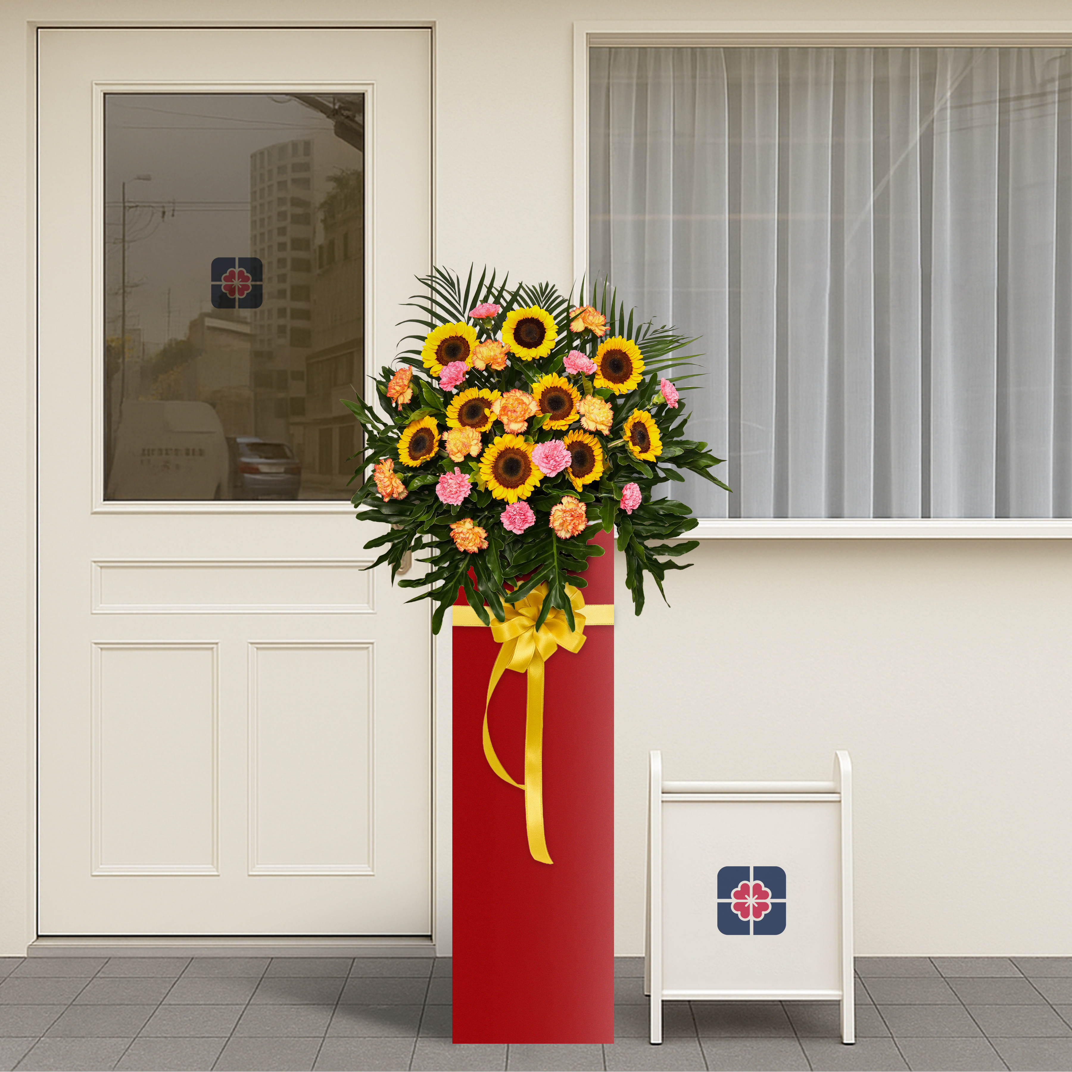 Sunburst Celebration consists of  9 sunflowers, 9 pink carnations, 2 orange carnations, and red wing leaves.   
