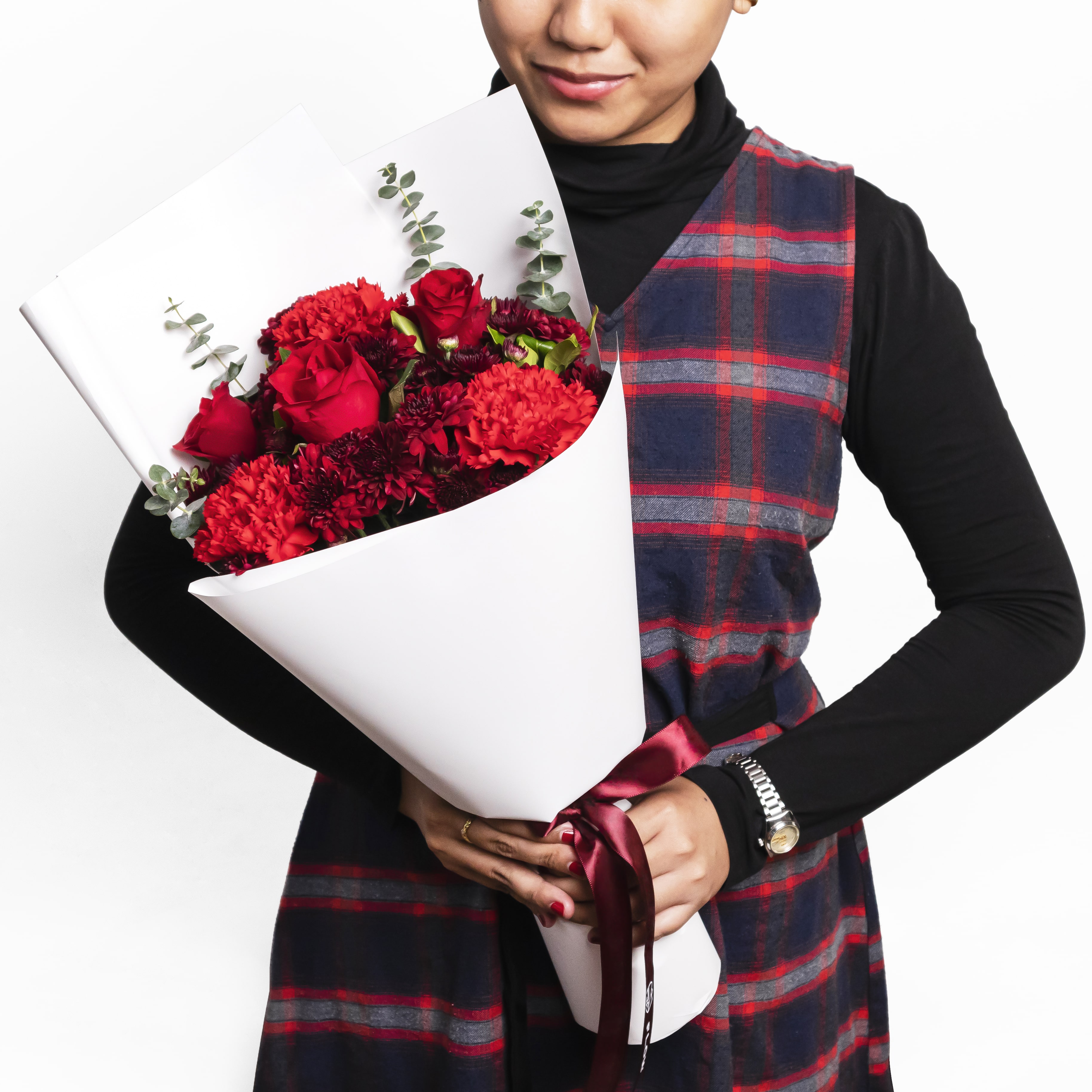 This bouquet consists of 6 magna red mums, 3 red roses, 3 red carnations, and eucalyptus leaves.
