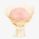 Bouquet of 99 light pink roses wrapped in beige paper and tied with a ribbon.