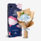 Blue hydrangeas, white carnations, and asters in brown paper with a blue and white ribbon.