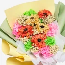 A bouquet of vibrant dried flowers, including orange daisies, yellow sunflowers, pink and green hydrangeas, and baby's breath.