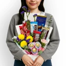 Chocolate and flower bouquet with Godiva, Kit Kat, and Hershey's bars.