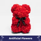 Red rose teddy bear with black ribbon that says "Just for you" against a white background.