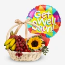 Wicker basket with bananas, grapes, dragon fruit, sunflower bouquet, and "Get Well Soon!" balloon.
