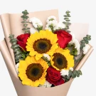 Bouquet of sunflowers, red roses, white statice, and eucalyptus leaves.