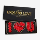 Black box with "I Love You" spelled out in red roses, heart-shaped rose arrangement in the middle.