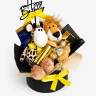 Birthday gift box with giraffe and lion plush toys, chocolates, and a "Happy Birthday" topper.