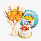 Birthday gift set with orange gerbera daisies, a "Happy Birthday" balloon, and a small strawberry shortcake.