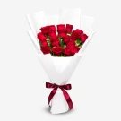 Bouquet of 18 vibrant red roses, elegantly wrapped in white paper and tied with a deep red ribbon.