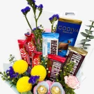 Chocolate bouquet with Hershey's, Kit Kat, Godiva, Ferrero Rocher, and yellow chrysanthemums.