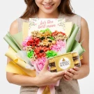 Woman holding a colorful bouquet of flowers with a card that says "for the best mom" and a box of Ferrero Rocher chocolates.