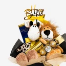 Birthday gift box with plush lion and giraffe, Godiva chocolate, Ferrero Rocher, and "Happy Birthday" cake topper.