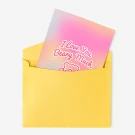 Yellow envelope holding a pink and purple gradient card with "I love you Beary Much" and a bear outline.