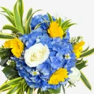 A bouquet of blue hydrangeas, yellow gerbera daisies, white roses, and green foliage.