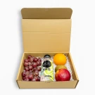 Fruitful Day gift box with grapes, orange, kiwi, apple, and Vida lime water.