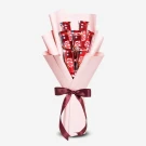 Pink bouquet with 7 milk chocolate KitKat bars tied with a burgundy ribbon.