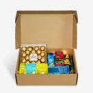 Ramadan Royale gift box with Ferrero Rocher, tea, dates, and nut mixes.