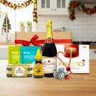 Gift set with sparkling juice, chocolates, candy canes, and Ferrero Rocher.