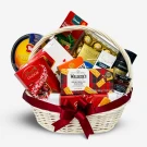Gift basket with Kjeldsens biscuits, Ferrero Rocher, Godiva chocolate, Belgian Seashells, Merci chocolates, and other gourmet items.