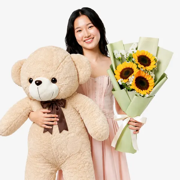 Woman holding a giant teddy bear and a bouquet of sunflowers.