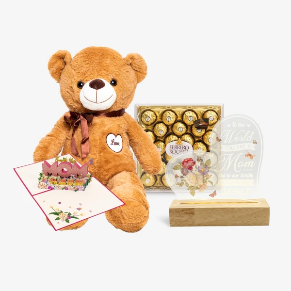 Teddy bear, Ferrero Rocher chocolates, a "Mom" pop-up card, and a lit keepsake for Mother's Day.