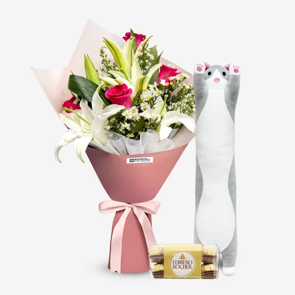 Bouquet of lilies and roses with a grey cat plush toy and Ferrero Rocher chocolates.