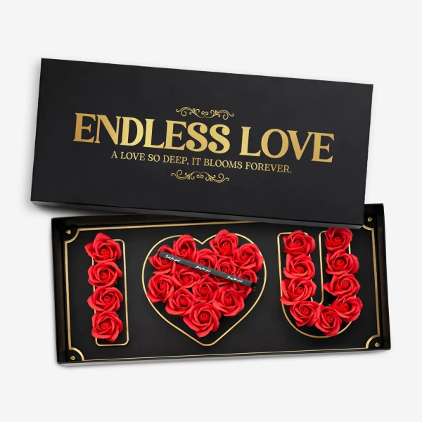 Black box with "I Love You" spelled out in red roses, heart-shaped rose arrangement in the middle.