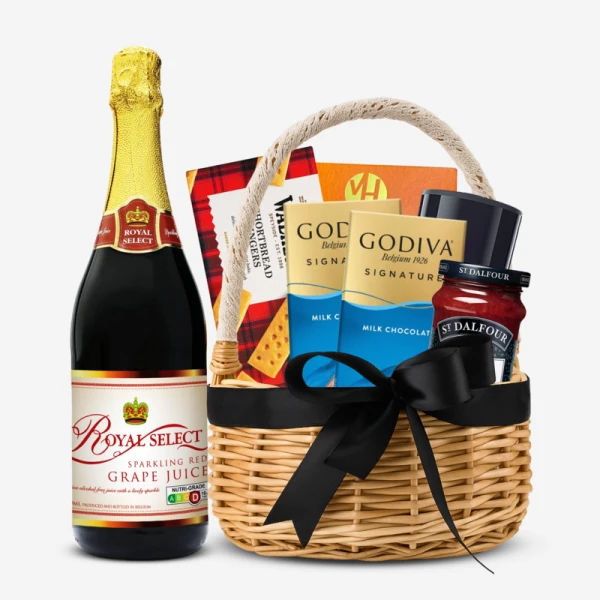 Gift hamper with sparkling grape juice, shortbread, cocoa, coffee, and Godiva chocolates.