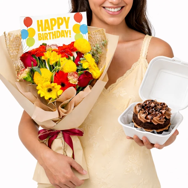 Woman holds a bright bouquet of flowers, a birthday card, and a chocolate cake.